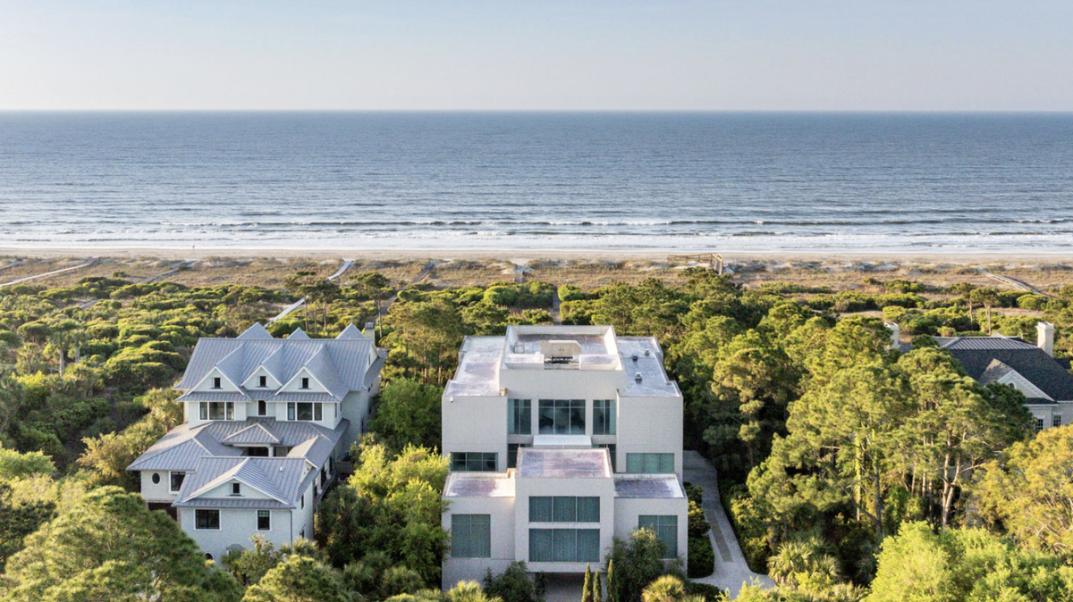 The house at 121 Flyway Drive is 11,911 square feet on 1.128 acres with 115 feet of beach frontage.
