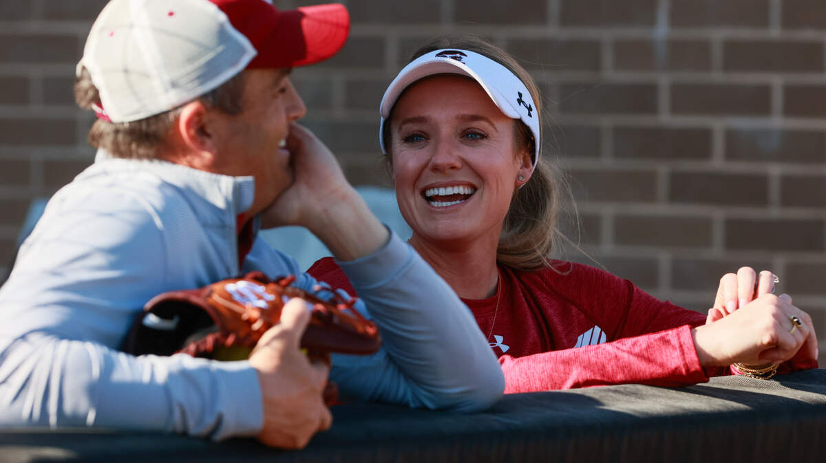 South Carolina head softball coach Ashley Chastain Woodard speaks with head football coach Shane Beamer before her team plays Clemson at Carolina Softball Stadium on Tuesday, March 25, 2025.