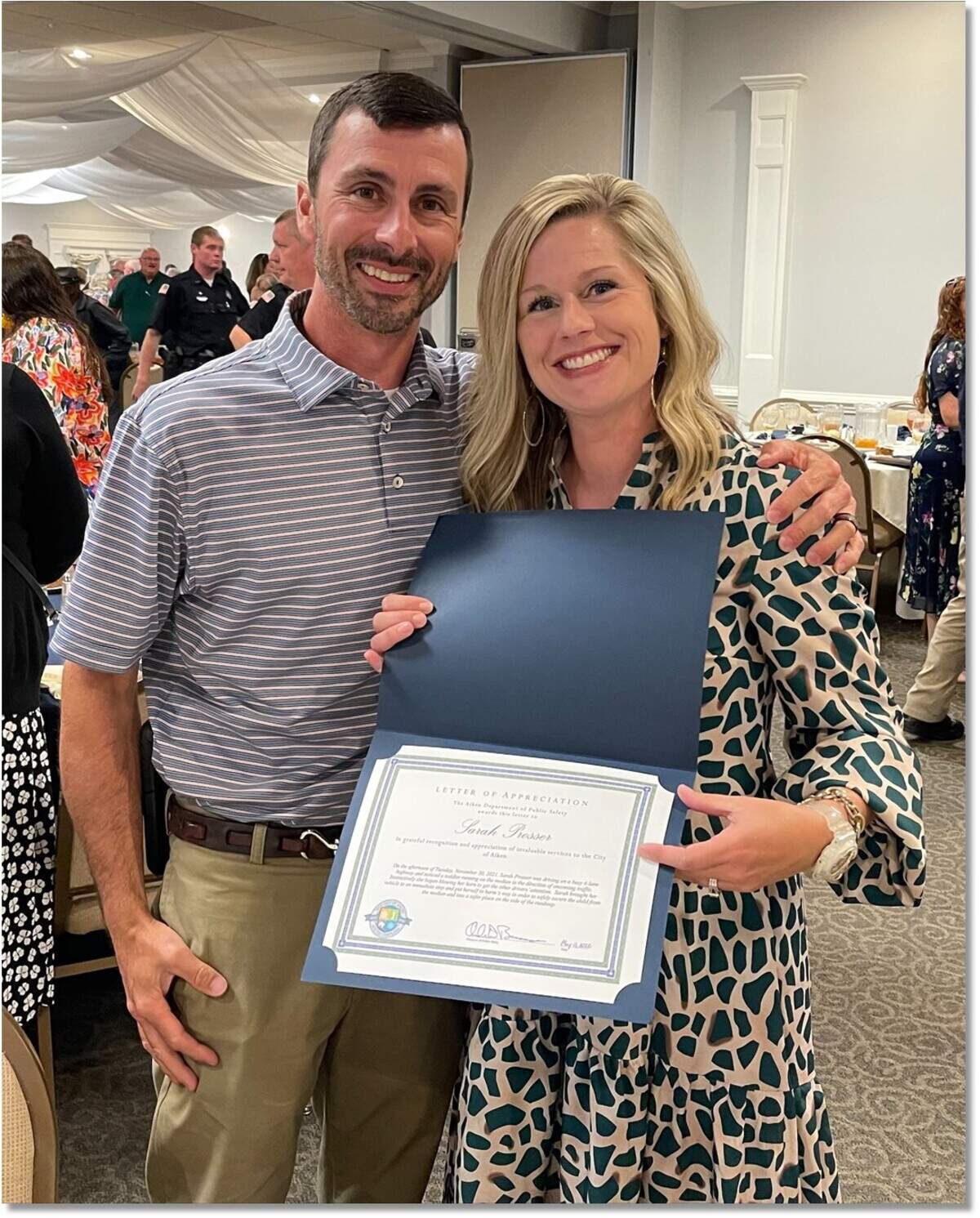 Sarah Prosser, right, was joined by her husband Zane when she recently received multiple awards for potentially saving the life of a small child.