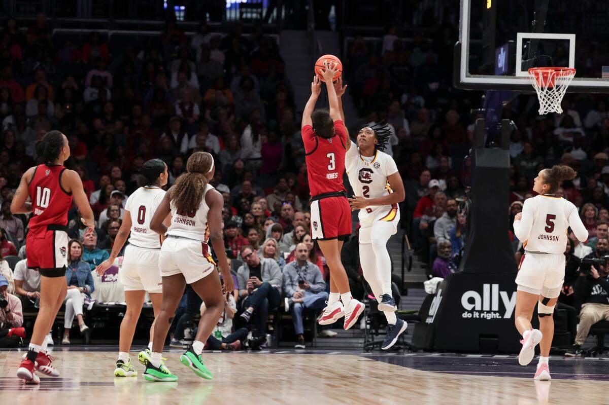University of South Carolina forward Ashlyn Watkins (2) blocks a shot by NC State guard Zamareya Jones (3) during the first half of action in the Ally Tipoff at the Spectrum Center in Charlotte on Sunday, Nov. 10, 2024.