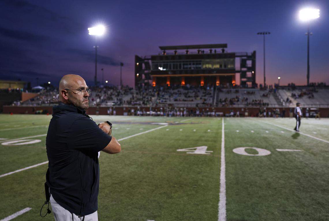 Lexington head coach Dustin Curtis walks the sideline Friday during the Lexington 1 Sports-A-Rama Jamboree at River Bluff High School.