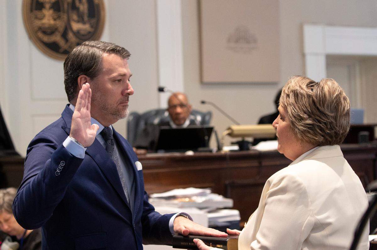 Michael Gunn, principle at Forge Consulting, gives the witness oath by Rebecca Hill in the double murder trial of Alex Murdaugh at the Colleton County Courthouse in Walterboro on Day 13 of Wednesday, Feb. 8, 2023. Andrew J. Whitaker/The Post and Courier/Pool