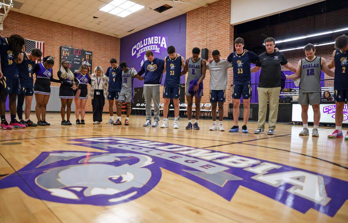 Players from Columbia College and Columbia International University pray together after their game at Godbold Gym in Columbia on Feb. 12.