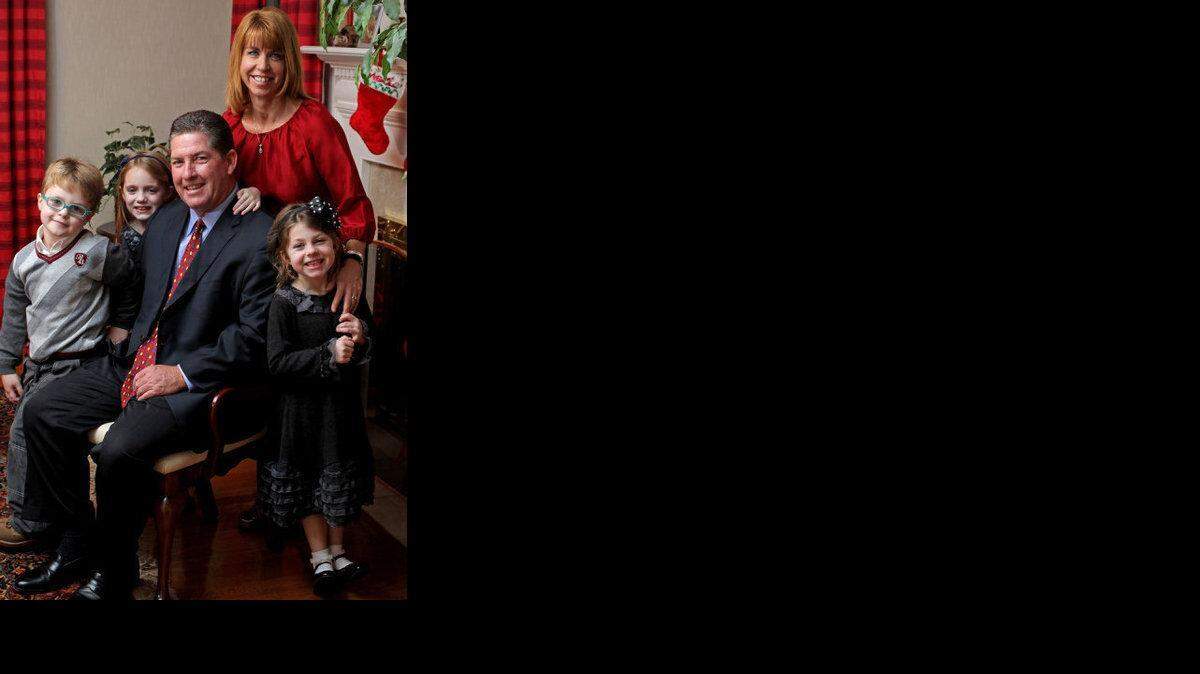 South Carolina baseball coach Ray Tanner is pictured with his wife Karen and children (left to right) Luke, Gracie and Maggie, inside the family’s home in Columbia.