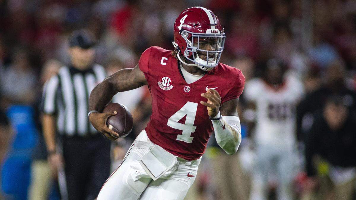 Sep 28, 2024; Tuscaloosa, Alabama, USA; Alabama Crimson Tide quarterback Jalen Milroe (4) runs against the Georgia Bulldogs during the first quarter at Bryant-Denny Stadium. Mandatory Credit: Will McLelland-Imagn Images