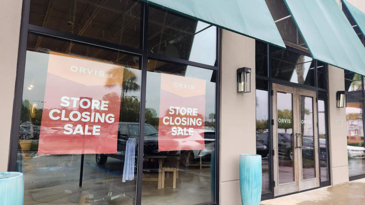 Signs in the windows at the Orvis store in Columbia in Cross Hill Market indicate the location is closing.