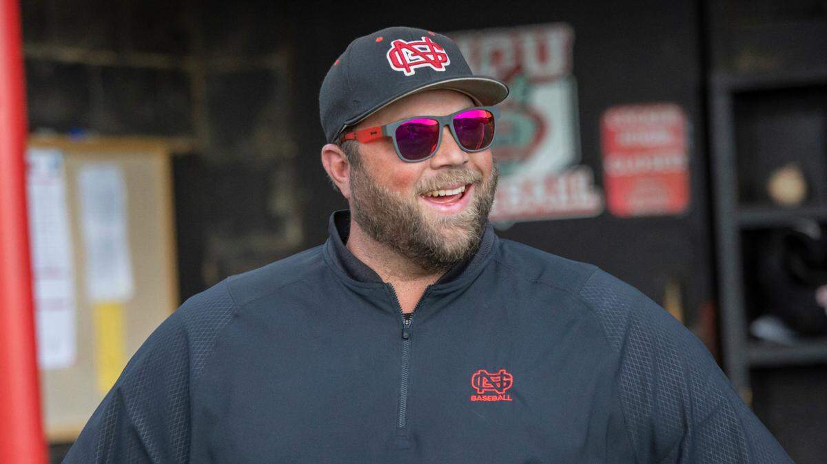 North Greenville head baseball coach Landon Powell by the dugout.