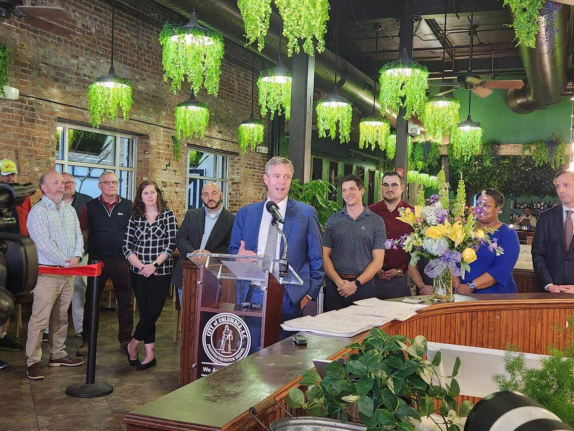 Columbia Mayor Daniel Rickenmann, center, speaks at the opening of The Hollow, a “forest-to-table” concept restaurant serving wild game at 823 Gervais St. in The Vista.