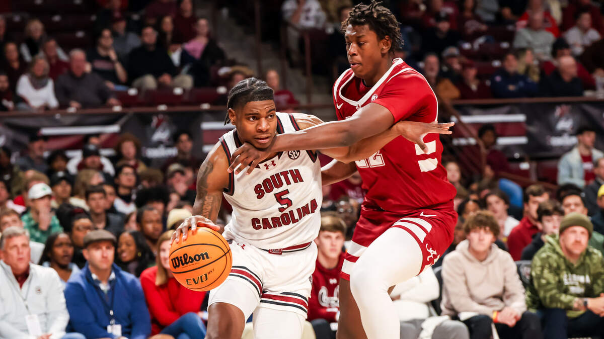 South Carolina Gamecocks forward Nick Pringle (5) drives around Alabama Crimson Tide forward Aiden Sherrell (22) in the Wednesday game at Colonial Life Arena.