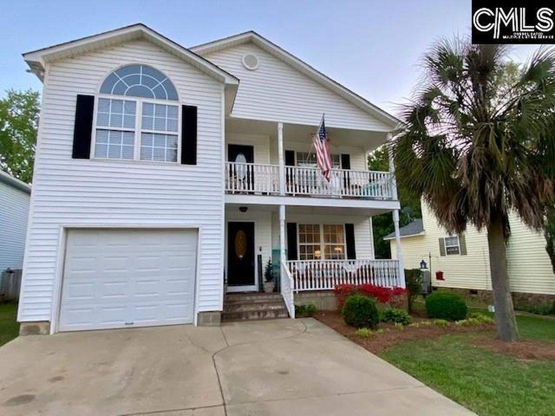 This Charleston style home in Chapin is located in a subdivision with community lake access.