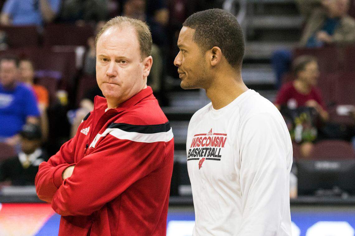 From March 2016, then-Wisconsin Badgers assistant coach Lamont Paris, right, talks to head coach Greg Gard during NCAA tournament practice in Philadelphia.