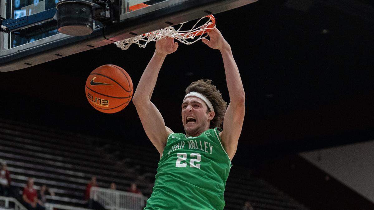 Dec 3, 2024; Stanford, California, USA; Utah Valley Wolverines forward Carter Welling (22) dunks the basketball against the Stanford Cardinal during the second half at Maples Pavilion.