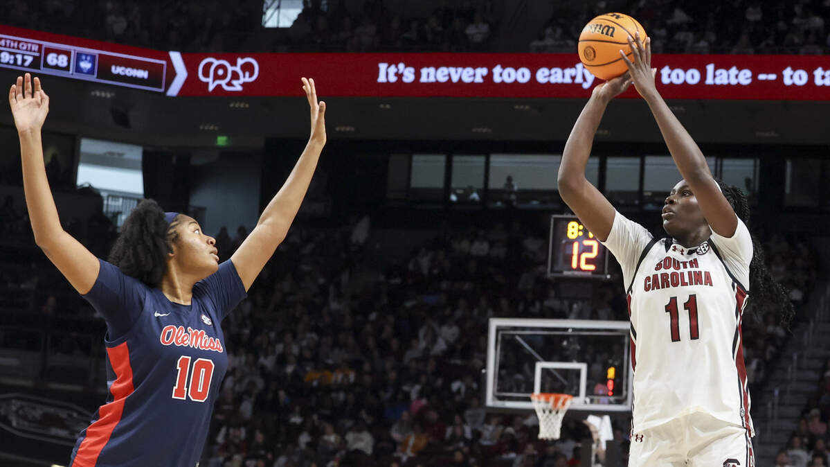South Carolina's Madina Okot (11) shoots a three point shot as University of Mississippi's J'Adore Young (10) pressures during the second half of action of their women's basketball game against Ole Miss at Colonial Life Arena on Sunday, Feb. 22, 2026.