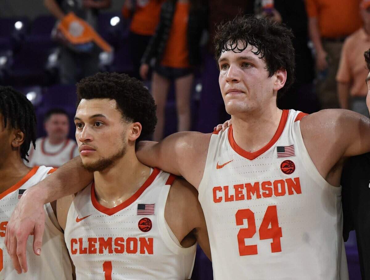Feb 22, 2023; Clemson, South Carolina, USA; Clemson guard Chase Hunter (1) and forward PJ Hall (24) join the alma mater after beating Syracuse 91-73 after the game at Littlejohn Coliseum. Mandatory Credit: Ken Ruinard-USA TODAY Sports