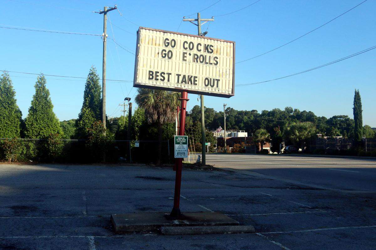 The former sign at Eggroll Station proclaimed “Go Cocks Go E*Rolls” for three decades.