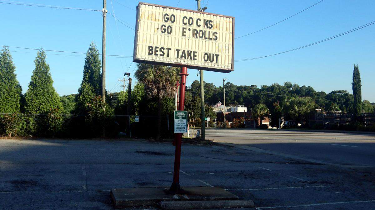 The sign at Eggroll Station has proclaimed “Go Cocks Go E*Rolls” for three decades.