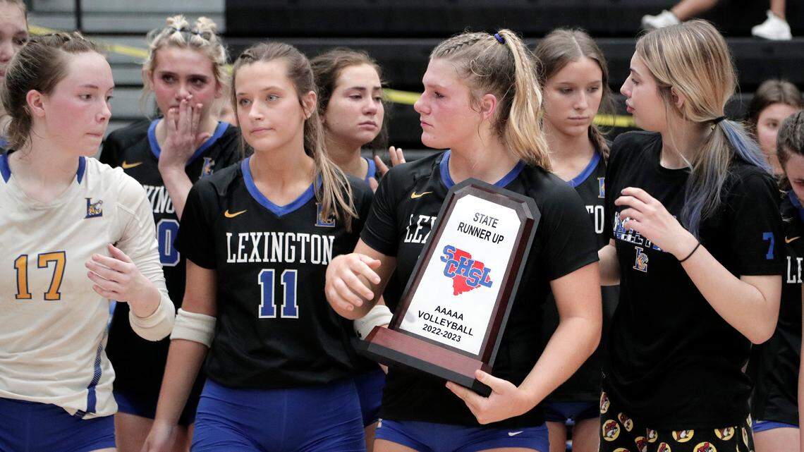 Lexington High School’s volleyball team is presented with the runner-up trophy Saturday in the Class 5A state championship, held at Dreher High School.