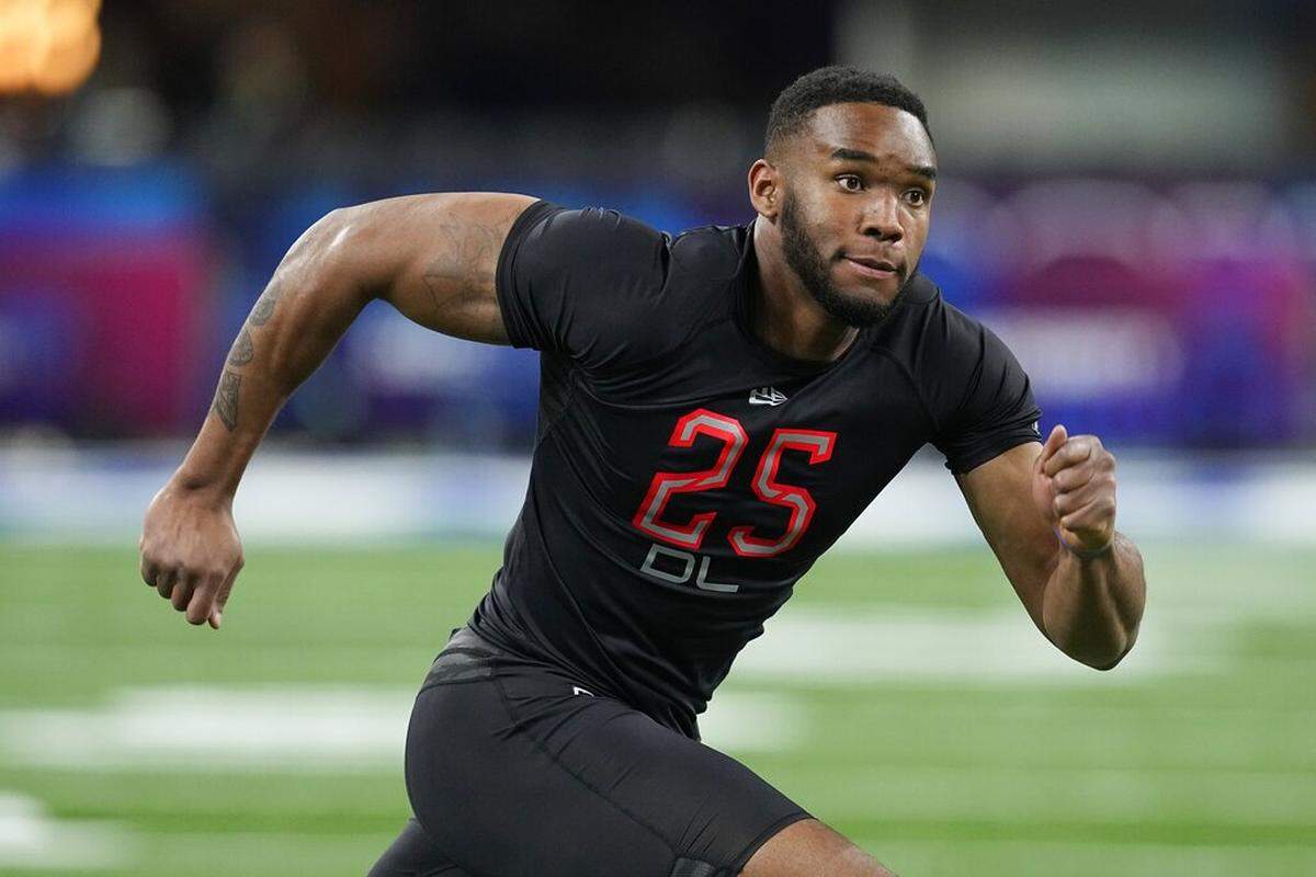 Virginia Tech defensive lineman Amaré Barno runs a drill during the NFL football scouting combine, Saturday, March 5, 2022, in Indianapolis.
