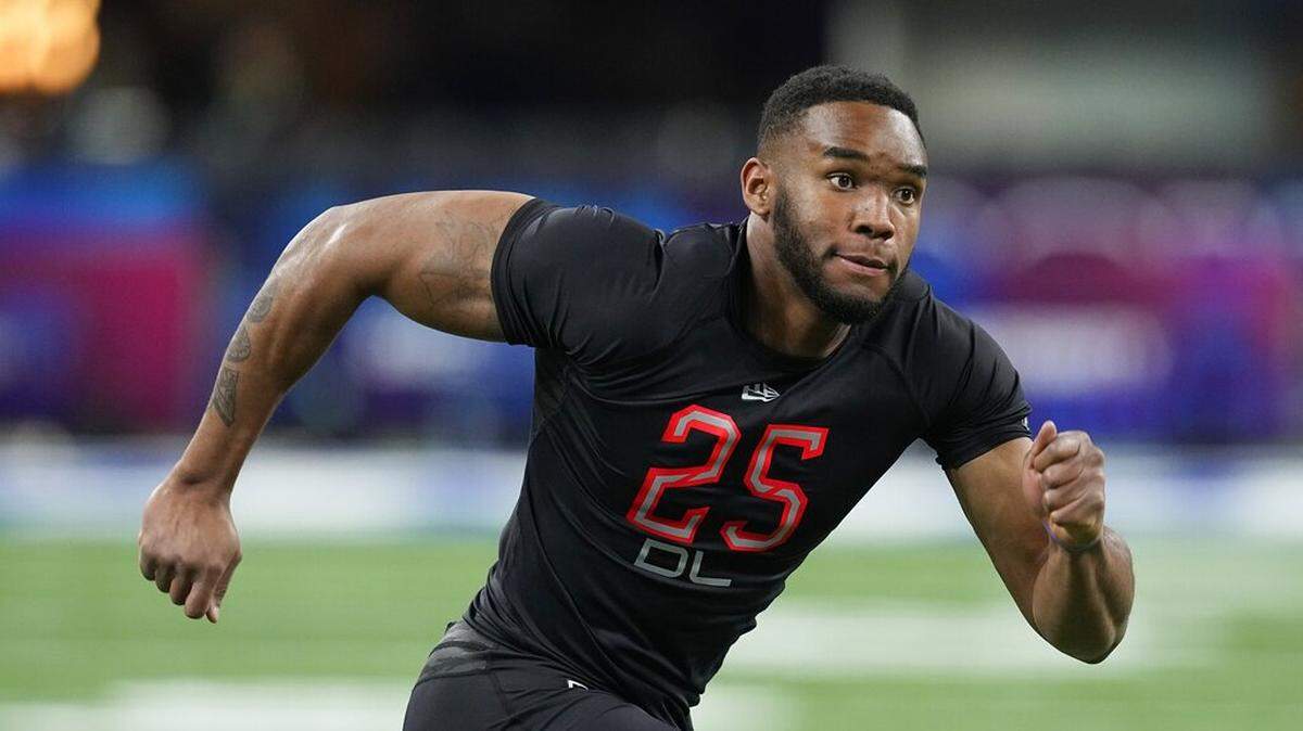 Virginia Tech defensive lineman Amaré Barno runs a drill during the NFL football scouting combine, Saturday, March 5, 2022, in Indianapolis.