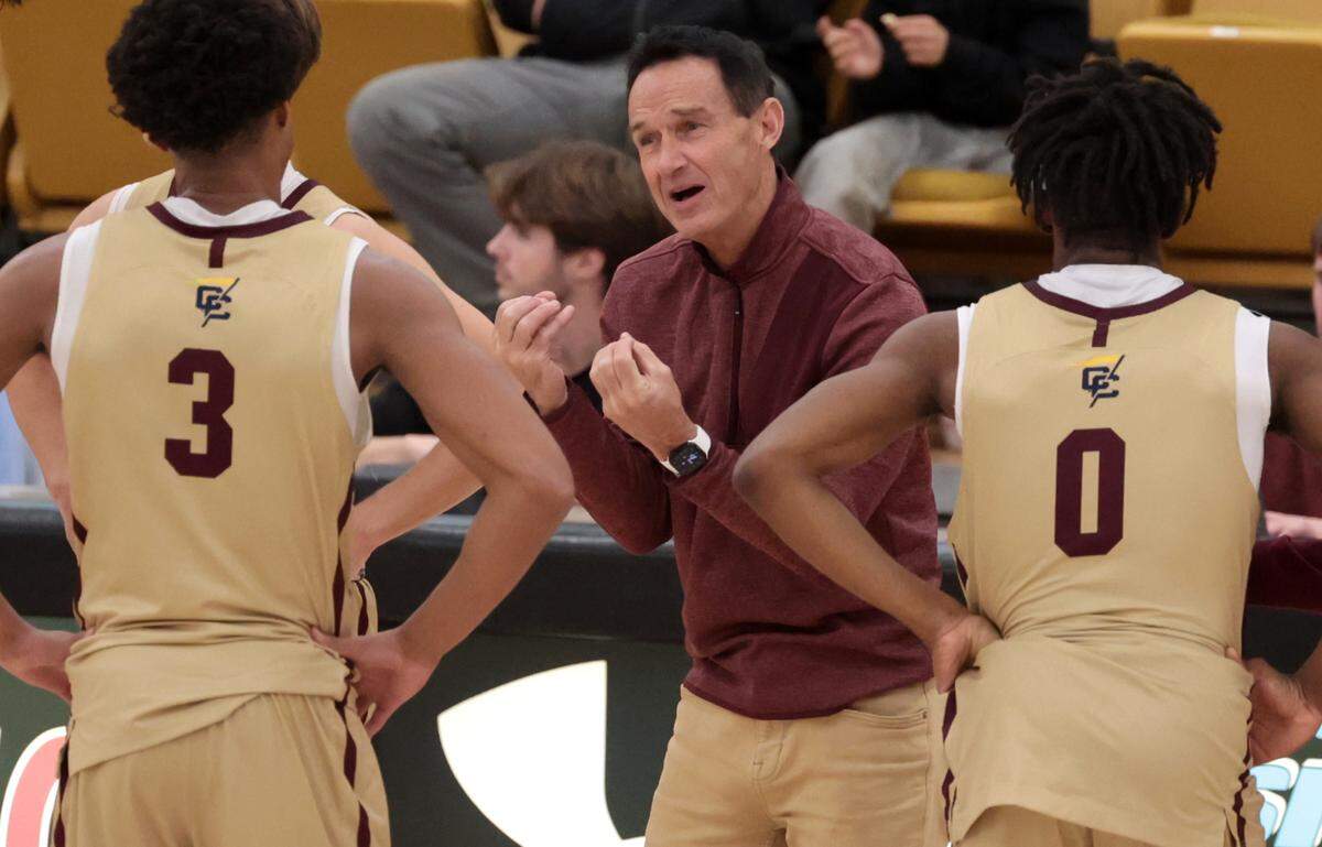 Erskine coach Mark Peeler coaches an Erskine College basketball game. Peeler coaches two developmental teams and a varsity team, is the school’s Athletic Director and teaches two classes. 