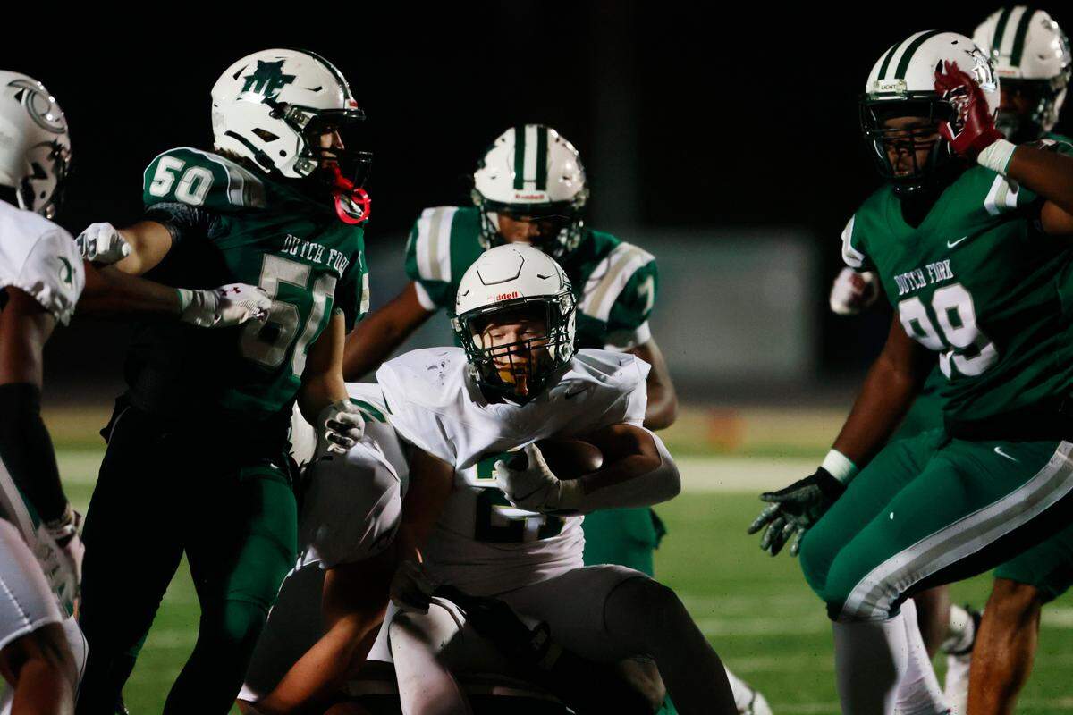 River Bluff’s Hayden Myers is taken down by Dutch Fork defenders at Dutch Fork on Friday, November 29, 2024.