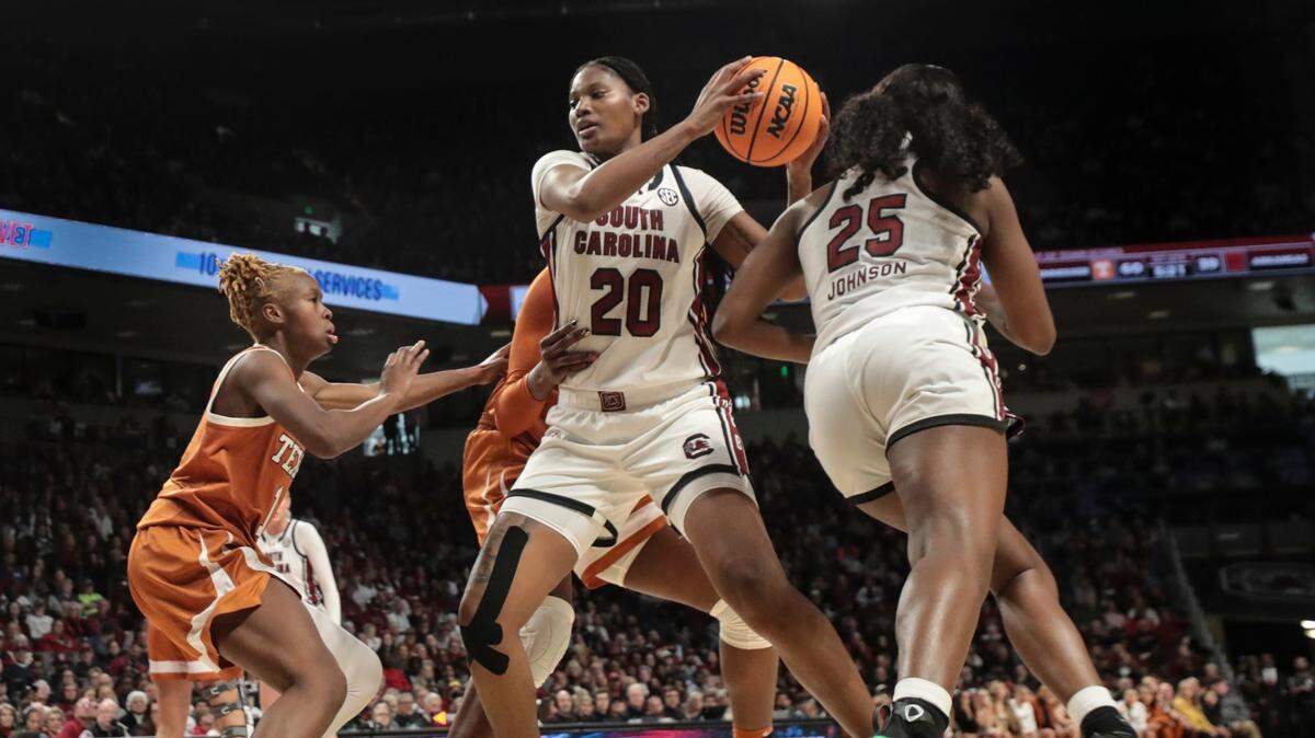 University of South Carolina’s Sania Feagin (20) is pressured by Texas’ Bryanna Preston (1) during the second half of action in the Colonial Life Arena on Sunday, Jan. 12, 2025. The Gamecocks won 67-50.