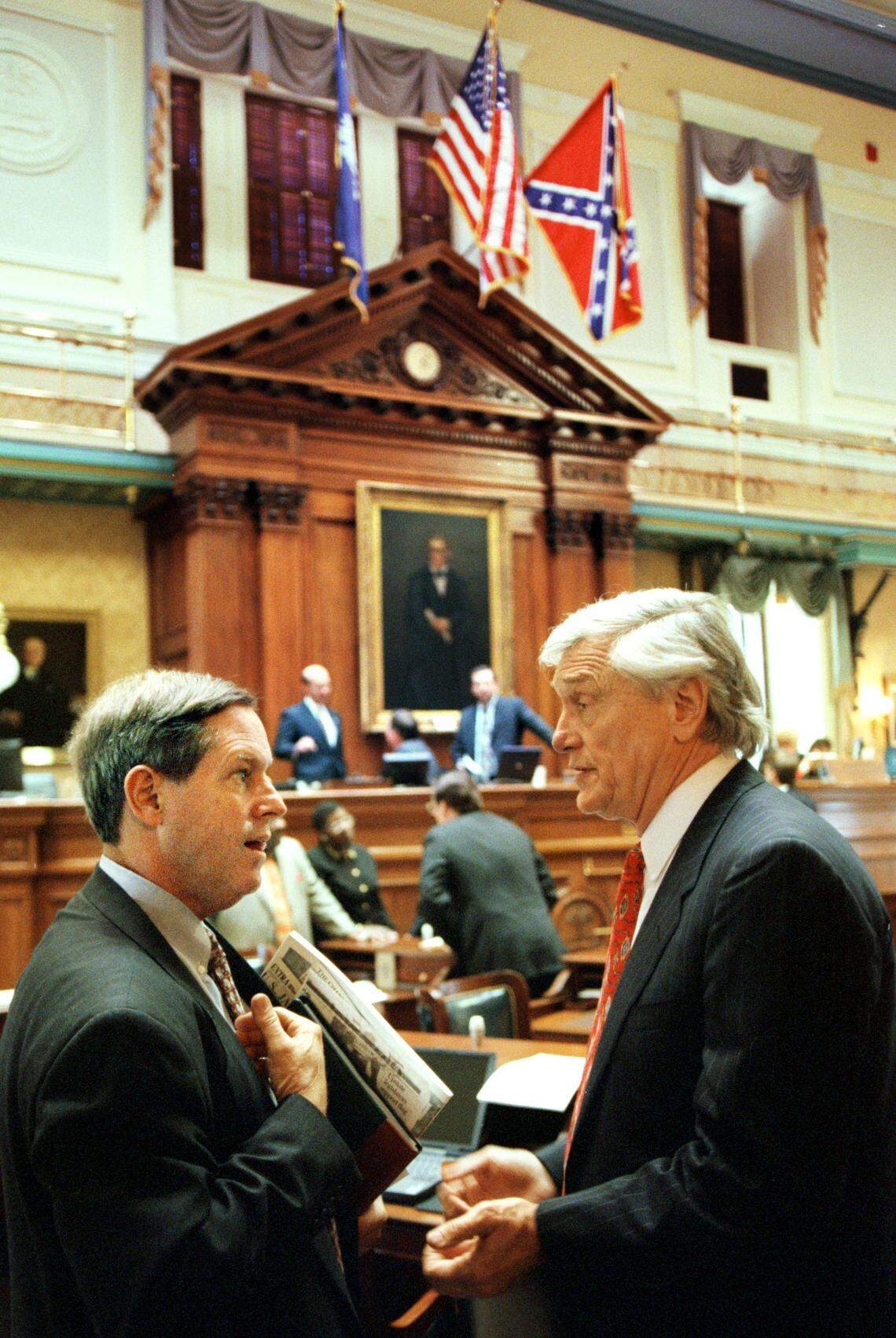 CURRENT state Sen. Joe Wilson., R-Lexington, left, discusses the Confederate flag on the Statehouse dome(Tuesday 1/11/2000) with former State Sen. Tom Turnipseed as Lawmakers returned to the Statehouse Tuesday for the first day of the legislative session with the Confederate flag at the top of the agenda.