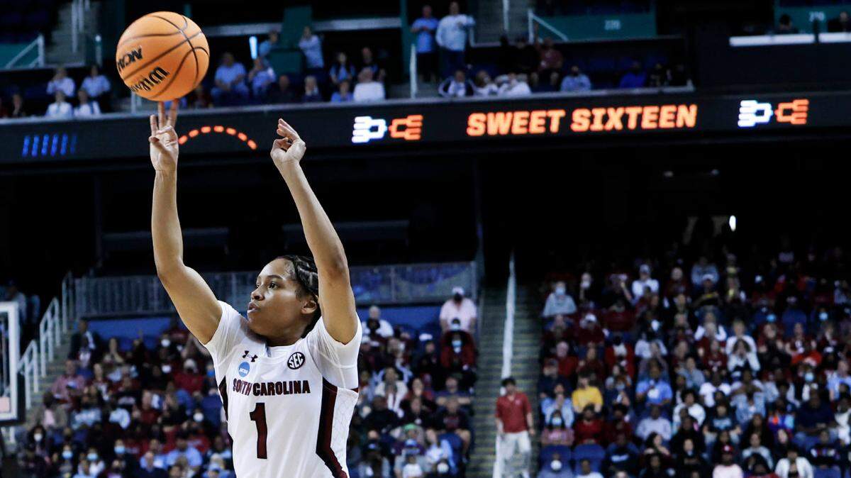 South Carolina’s Zia Cooke (1) shoots a three pointer as North Carolina’s Deja Kelly (25) pressures during the first half of action during the Sweet 16 game at the Greensboro Coliseum on Friday, March 25, 2022.
