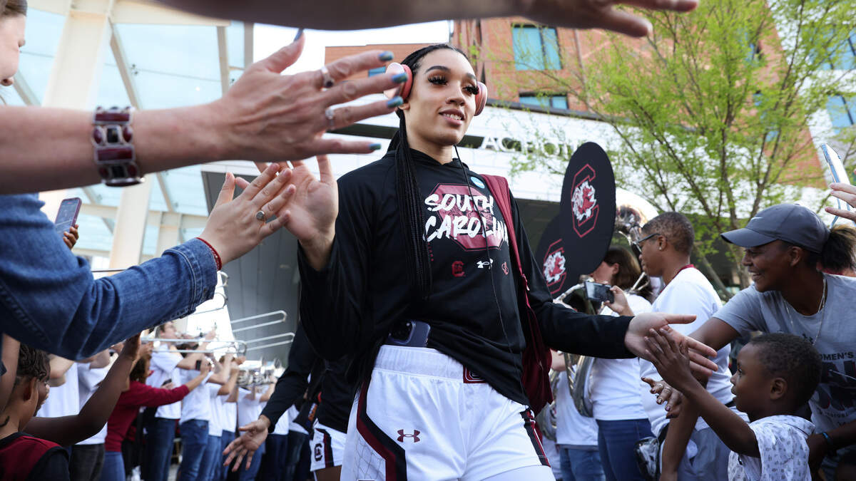South Carolina Gamecocks guard Brea Beal (12) is greeted by fans as she leaves the team’s hotel before the Elite 8 round of the 2023 NCAA Tournament at Bon Secours Wellness Arena in Greenville on Monday, March 27, 2023.