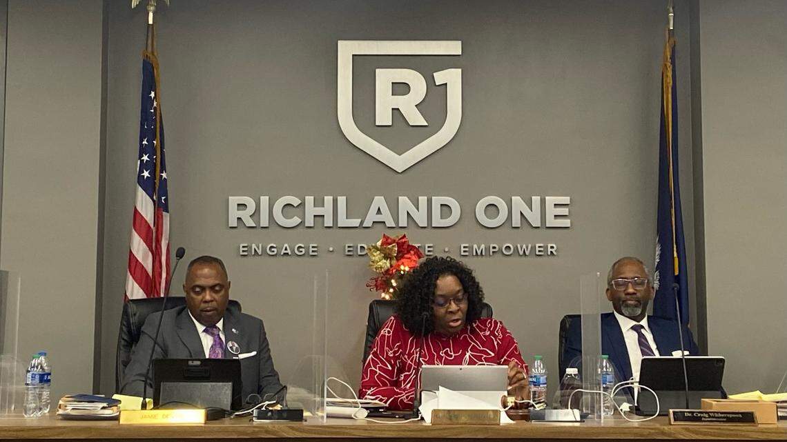 Ericka Hursey is suing Richland 1 and school board chair Cheryl Harris (center) for removing her as principal of Lower Richland High School.