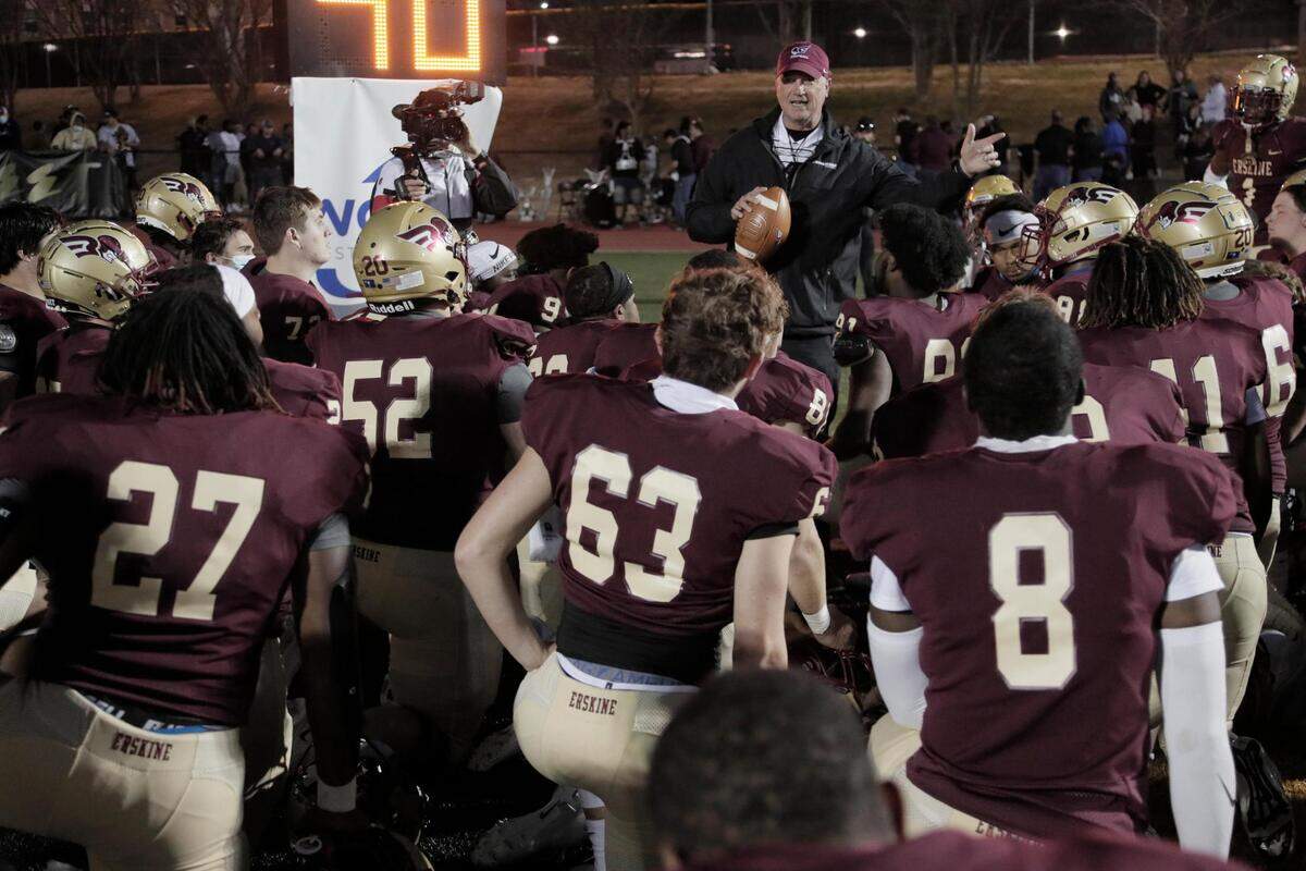 Erskine College head coach Shap Boyd speaks to his team after losing to Shorter University on Saturday, March 13, 2021.