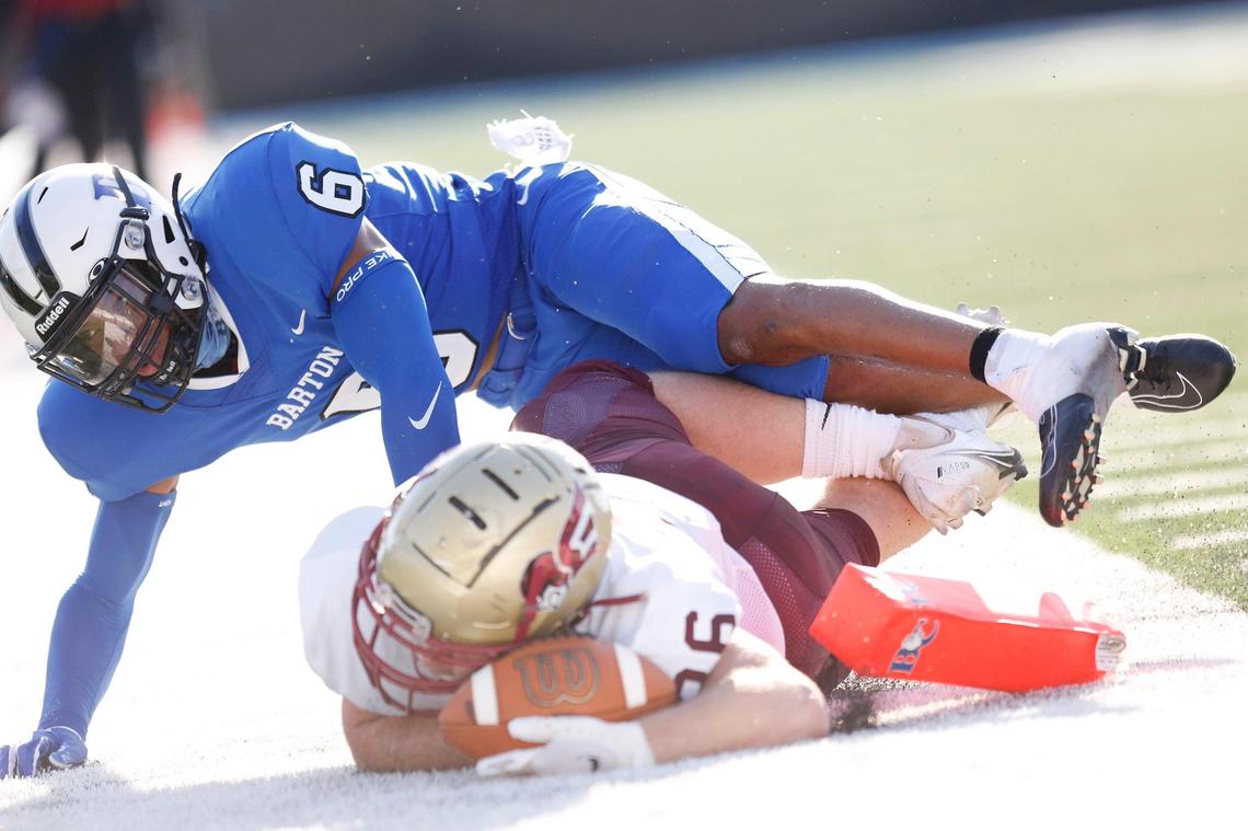 Erskine running back Collin Whitfield scores a touchdown as he crashes to the field with Barton Bulldogs defensive back Quayon Gilbert (6) in the third quarter Saturday.