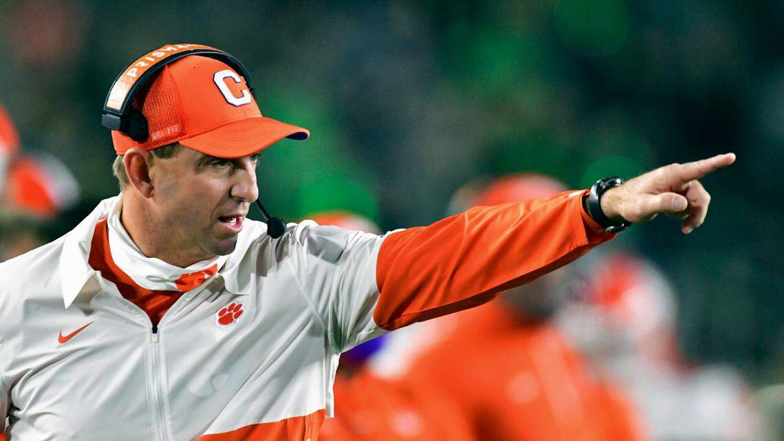 FILE - In this Saturday, Nov. 7, 2020, file photo, Clemson coach Dabo Swinney signals to his players during the second quarter against Notre Dame in an NCAA college football game in South Bend, Ind.