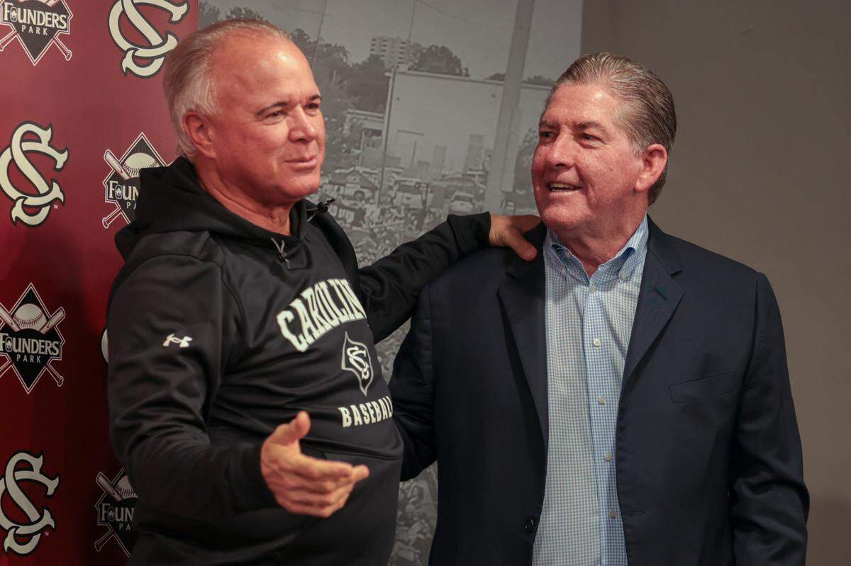 University of South Carolina baseball coach Paul Mainieri and Ray Tanner share a moment during a press conference. Tanner will be honored by naming the field, Ray Tanner Field.