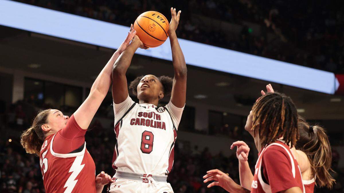 University of South Carolina’s Joyce Edwards (8) shoots as Arkansas’ Danika Galea (25) pressures during the first half of action in the Colonial Life Arena on Thursday, Feb. 20, 2025.