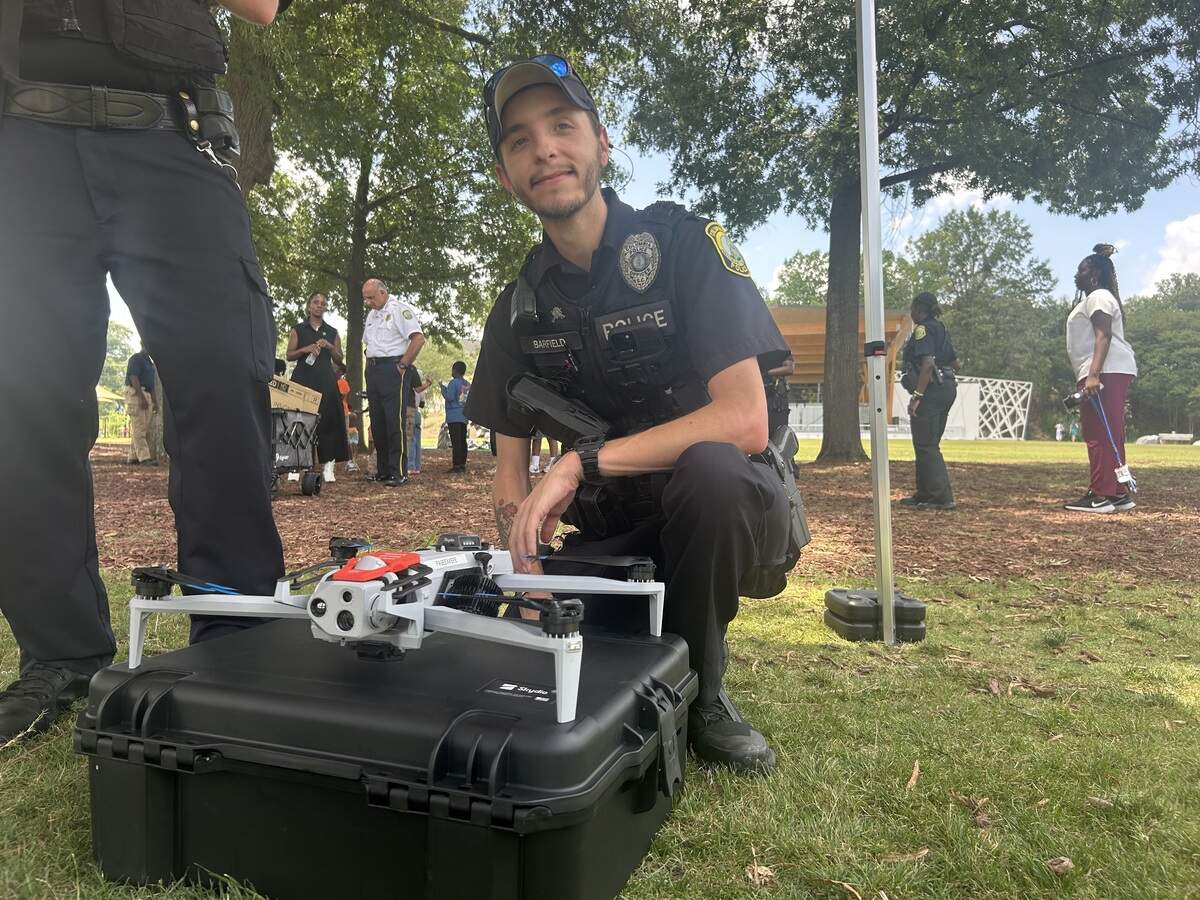 Officer is with a flying drone.