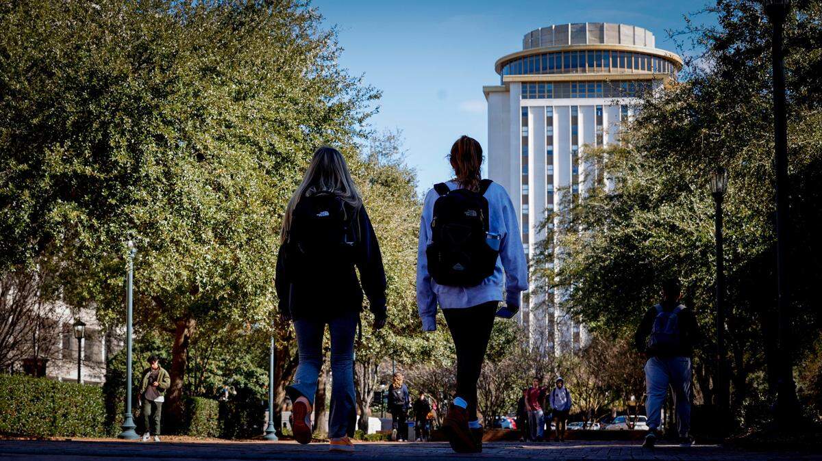 Students walk across campus at the University of South Carolina in Columbia.
