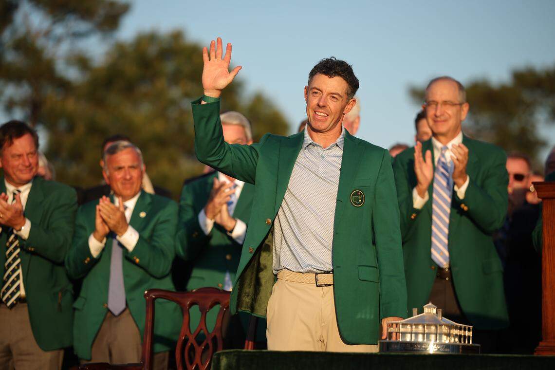 Rory McIlroy of Northern Ireland reacts after being awarded the Green Jacket during the Green Jacket Ceremony after winning the 2026 Masters Tournament at Augusta National Golf Club on Sunday in Augusta, Georgia.