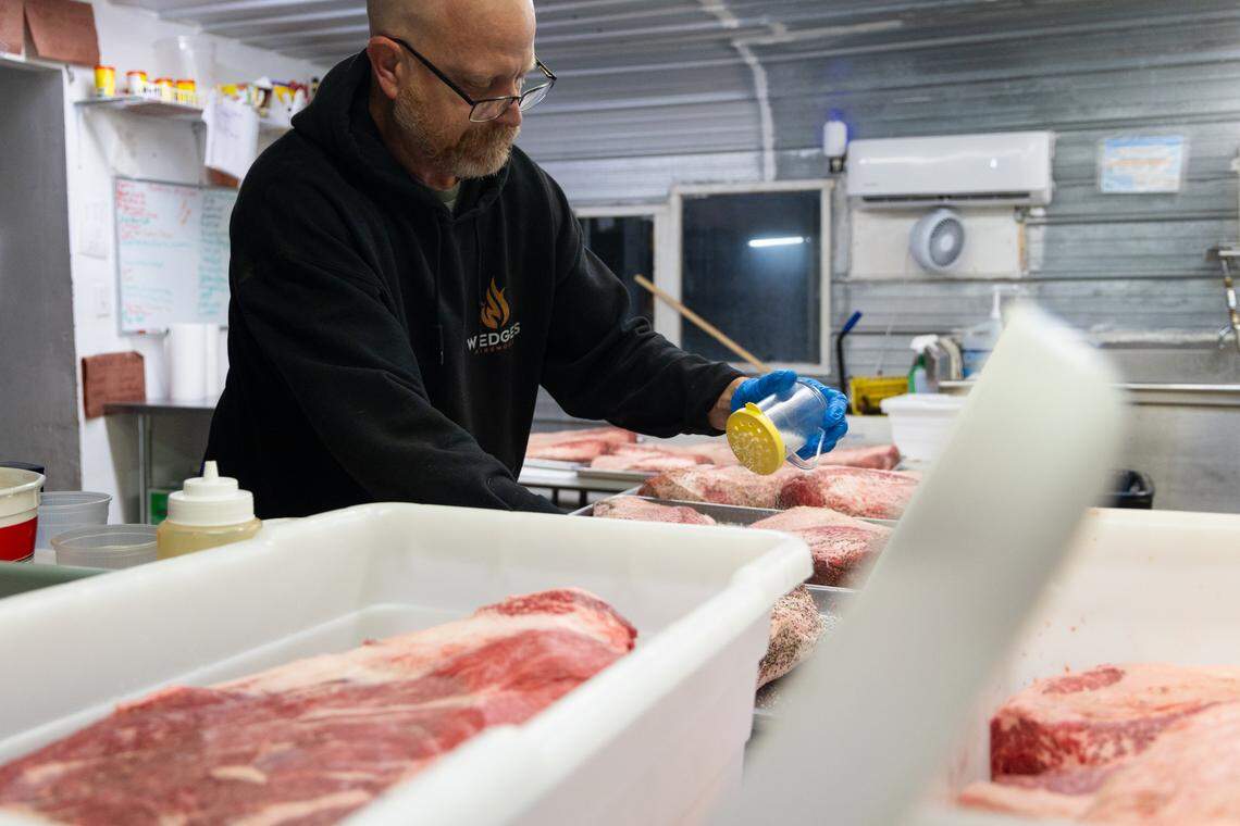 Robbie Robinson, owner of City Limits Barbeque in West Columbia, prepares over a dozen briskets before dawn on Friday, March 28, 2025.