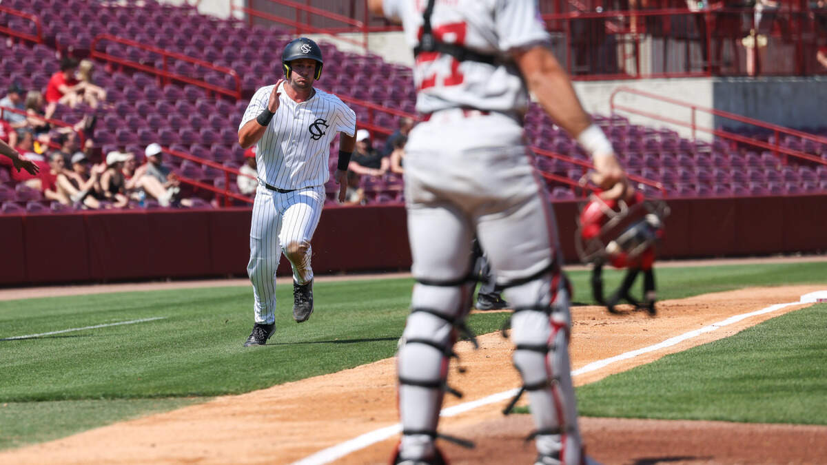 South Carolina catcher Jake Randolph (21) scores during the Gamecocks’ game against Arkansas at Founders Park in Columbia on Sunday, March 22, 2026.