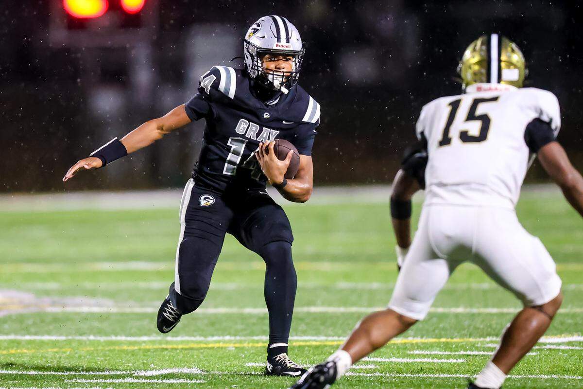Gray Collegiate quarterback Xavier Wright (14) scrambles during their game against North Augusta High at Gray Collegiate Academy Friday night, 9/26/25.