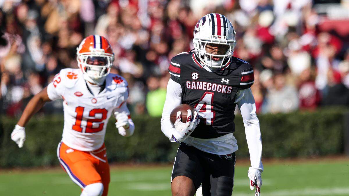 South Carolina wide receiver Vandrevius Jacobs (4) carries the ball for a touchdown during first half of South Carolina’s game against Clemson at Williams-Brice Stadium in Columbia on Saturday, November 29, 2025.