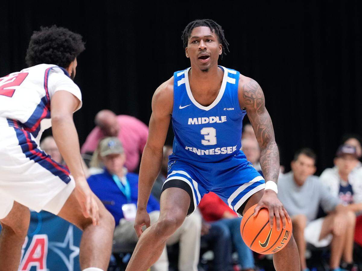 Mar 10, 2023; Frisco, TX, USA; Middle Tennessee Blue Raiders guard Jestin Porter (3) controls the ball as Florida Atlantic Owls guard Jalen Gaffney (12) defends during the first half at Ford Center at The Star.