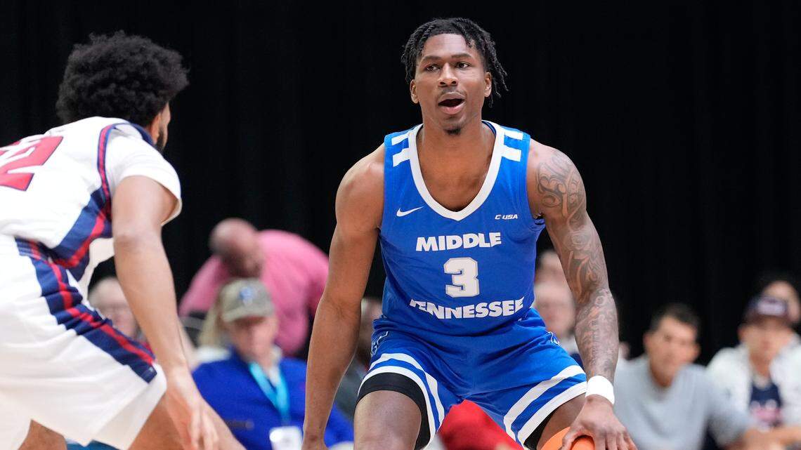 Mar 10, 2023; Frisco, TX, USA; Middle Tennessee Blue Raiders guard Jestin Porter (3) controls the ball as Florida Atlantic Owls guard Jalen Gaffney (12) defends during the first half at Ford Center at The Star.