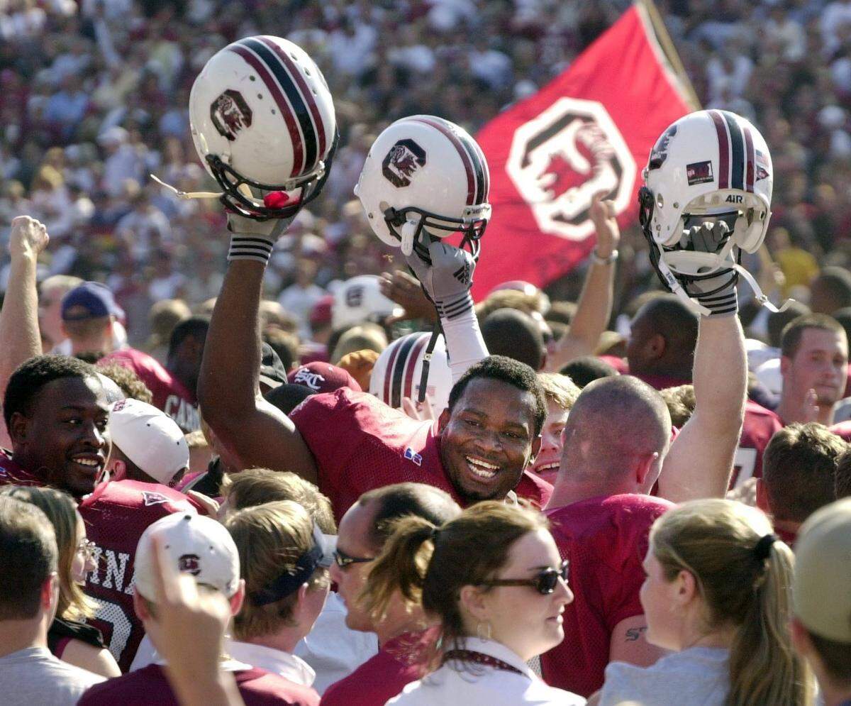From Sept. 29, 2001: South Carolina offensive lineman Melvin Paige, center, celebrates with teammates and fans as the Gamecocks come from behind to defeat Alabama at Williams-Brice Stadium.