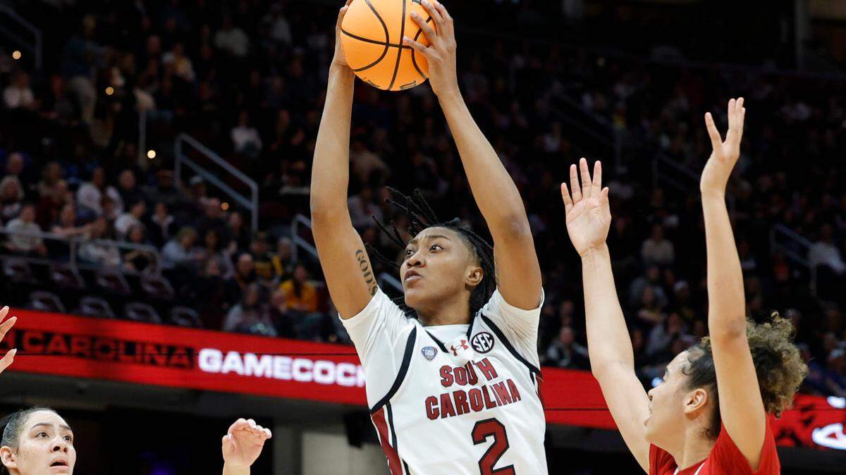 South Carolina’s Ashlyn Watkins (2) pulls down a rebound as NC State’s Mimi Collins (2) and NC State’s Madison Hayes (21) pressure during the Final Four game at Mortgage FieldHouse in Cleveland, Ohio on Friday April 5, 2024.