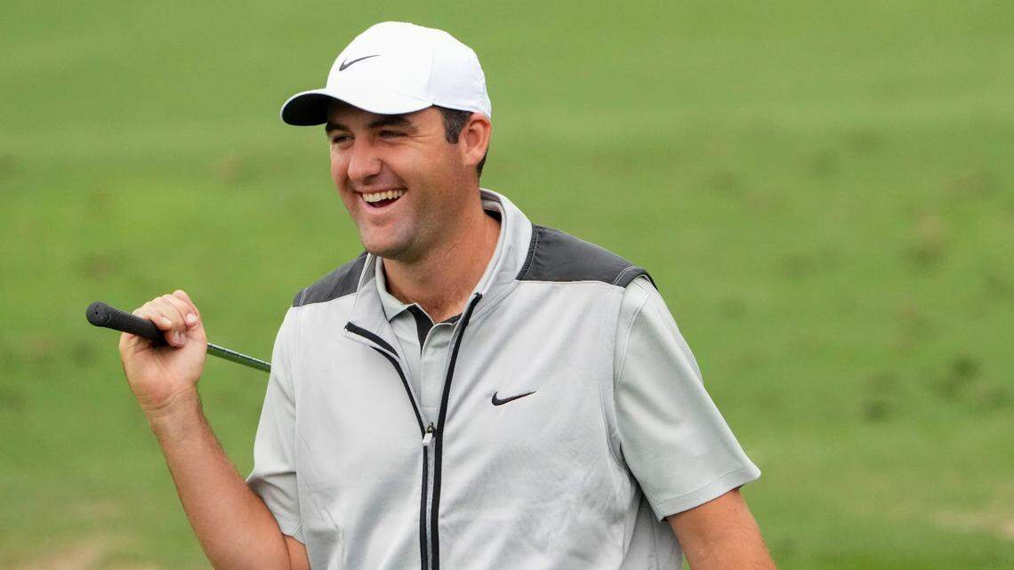 Scottie Scheffler laughs at the practice facility during a practice round this week for The Masters golf tournament at Augusta National Golf Club.
