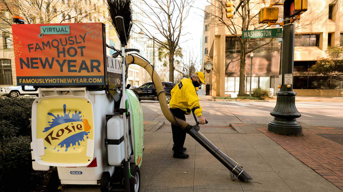 David Kellogg operates Rosie, an industrial multi-purpose vacuum, along Columbia’s Main Street. The Yellow Shirts, employed through City Center Partnership work daily around Main Street, keeping things tidy, offering security and providing information.