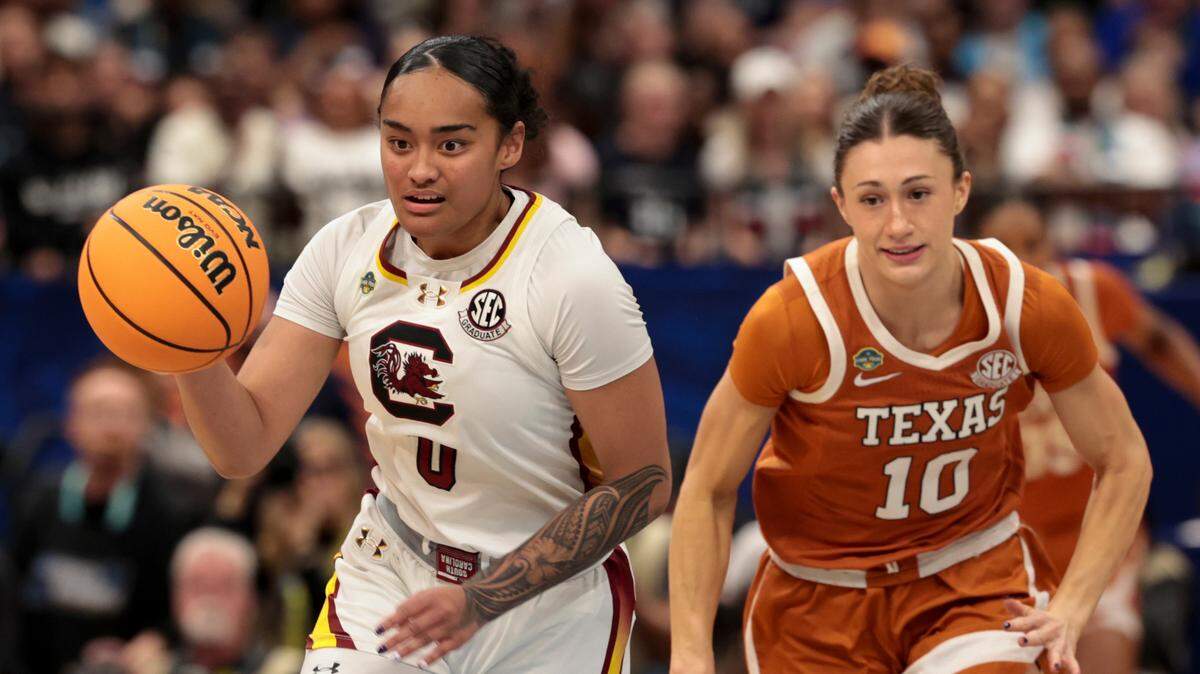 University of South Carolina’s Te-Hina Paopao (0) is pursued by Texas’ Shay Holle (10) during the first half at Amalie Arena in Tampa, Fla. on Friday, April 4, 2025.