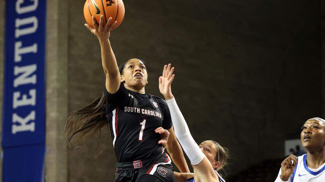 South Carolina’s Zia Cooke (1) shoots while defended by Kentucky’s Maddie Scherr (22) during the first half of an NCAA college basketball game in Lexington, Ky., Thursday, Jan. 12, 2023. (AP Photo/James Crisp)